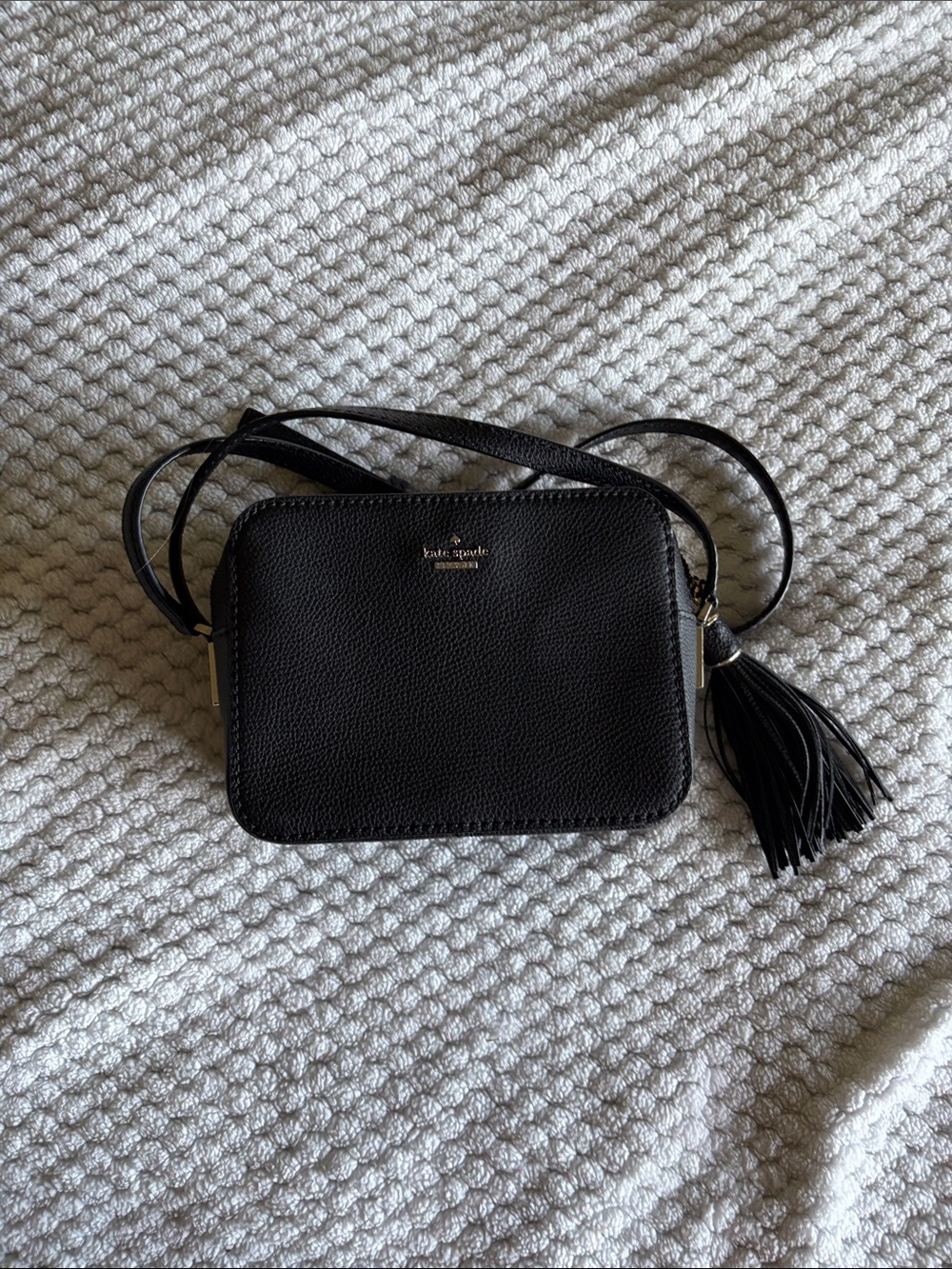 kate spade black leather crossbody with tassel accent